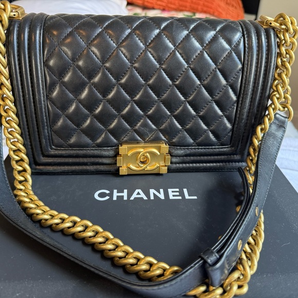 CHANEL Handbags - Pre-Owned Chanel Black Quilted Leather Bag with Gold Chain